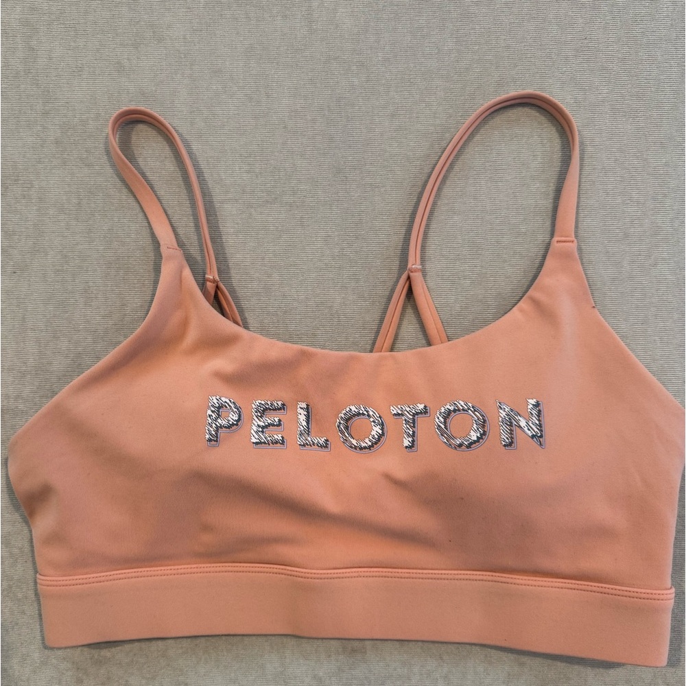 Soft pink Peloton sports bra
